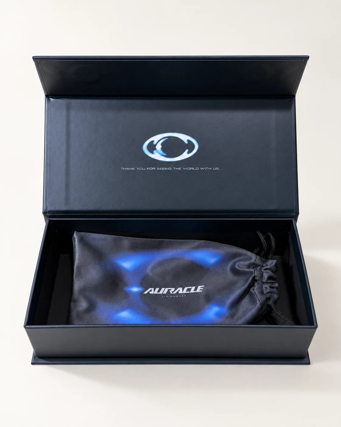Auracle current packaging with the box open and pouch inside.