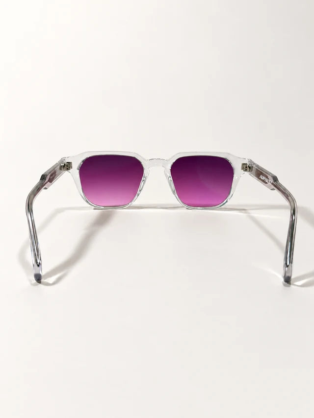 Auracle AUR-001 C2. Rear view of clear square sunglasses with purple-pink lenses, open temples and AURACLE branding on the inner arm.